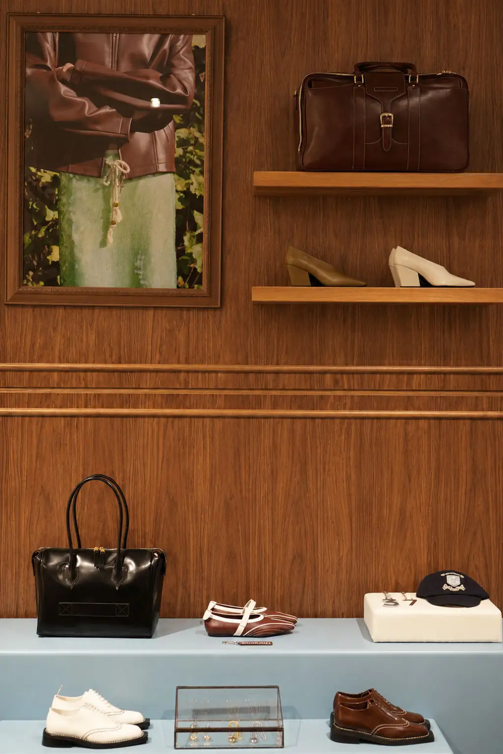 Bespoke timber display wall with product shelving in a retail store interior