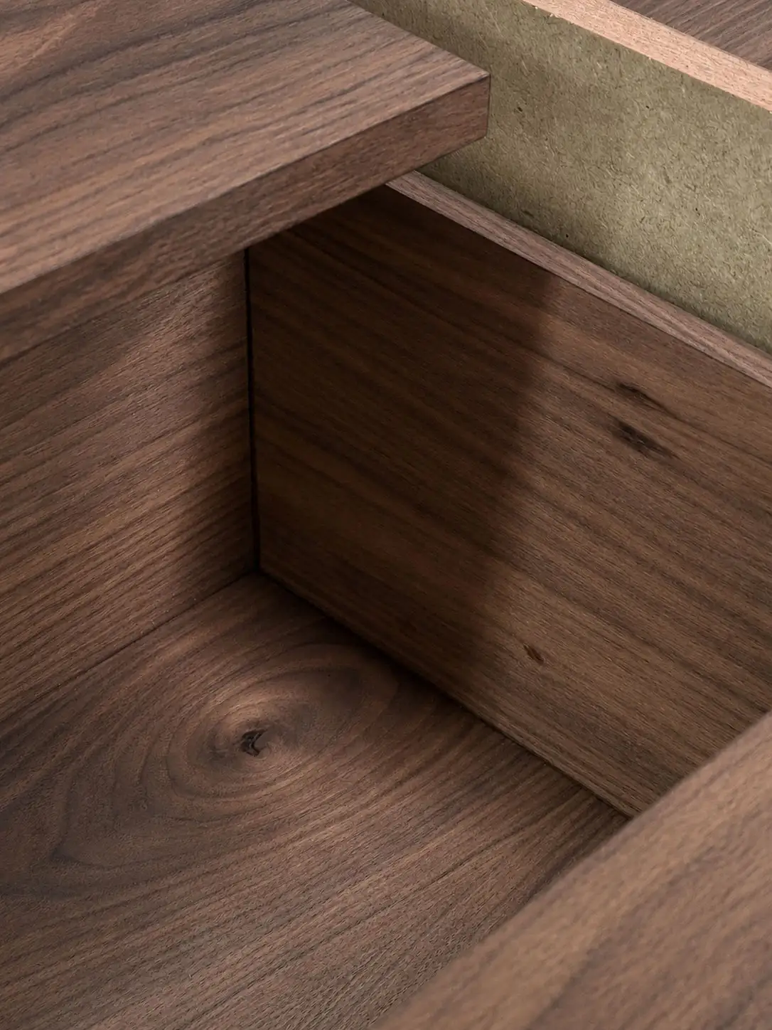 Solid walnut joinery detail showing precision corner jointing by Studio Tuesday