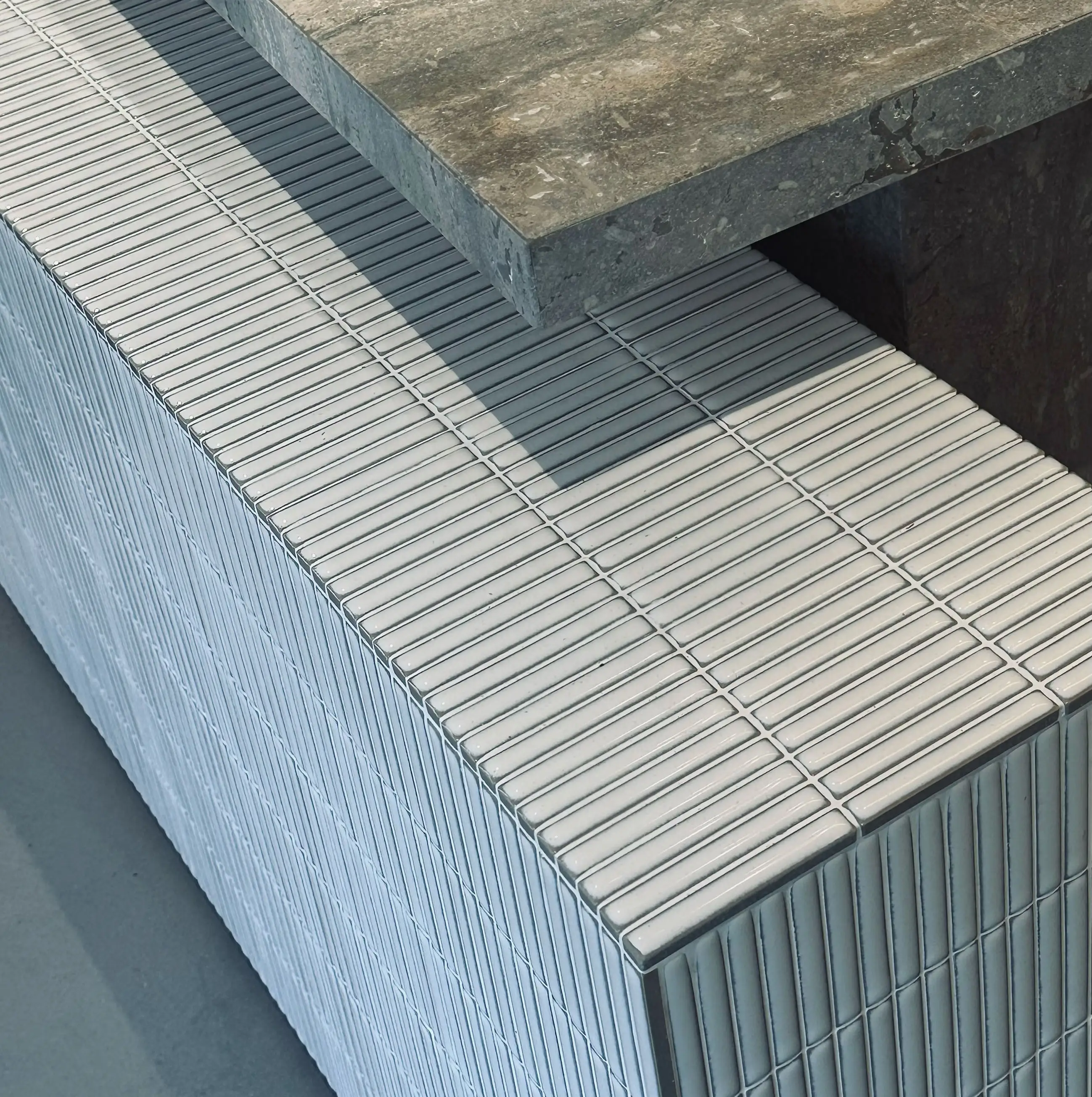 Fluted timber panel detail crafted in-house for a retail fit-out