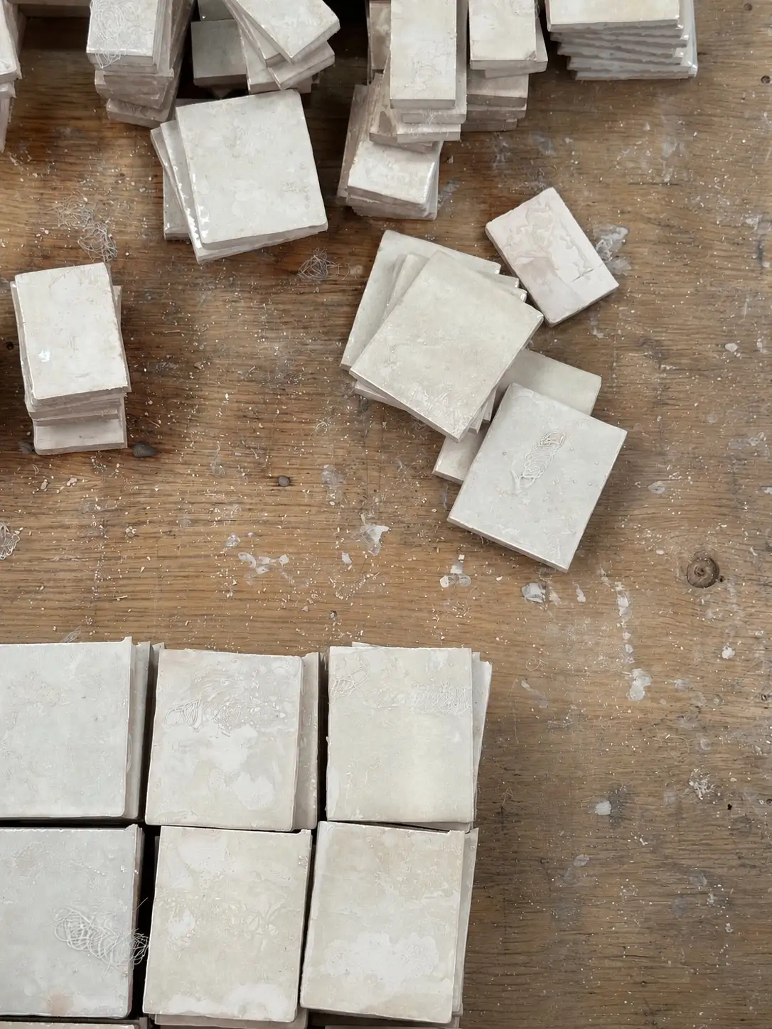 Textured stone and plaster material samples for bespoke retail interiors